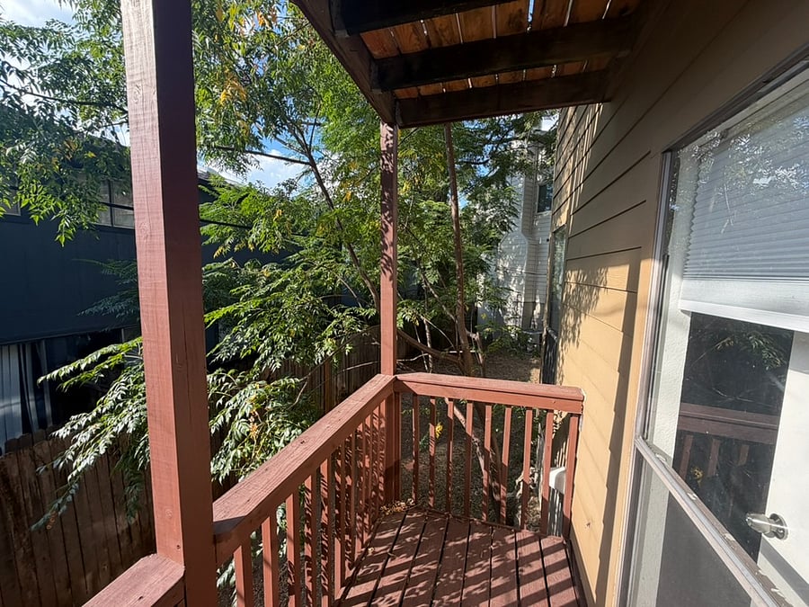 yard is larger than it appears in this photo, wraps around the side of the home.
