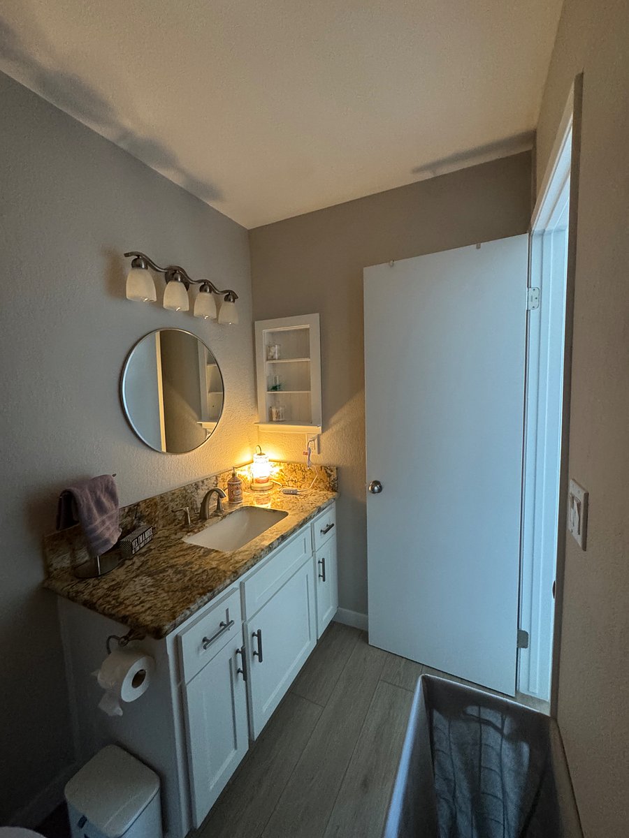 Always turn on the candle warmer when taking a shower to enjoy the spa vibes that this bathroom's giving