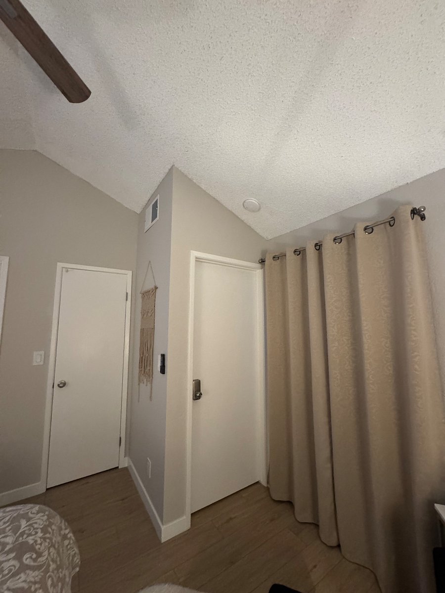 Kitchenette and downstairs door.