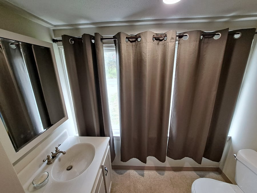 Private 1/2 bath with room darkening drapes