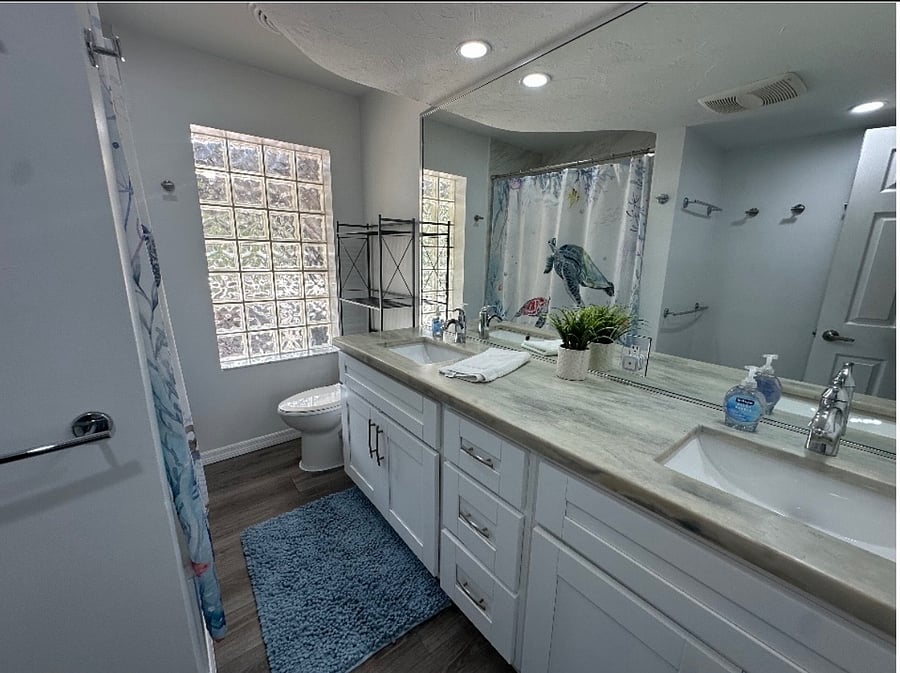 Double sinks, tub and shower