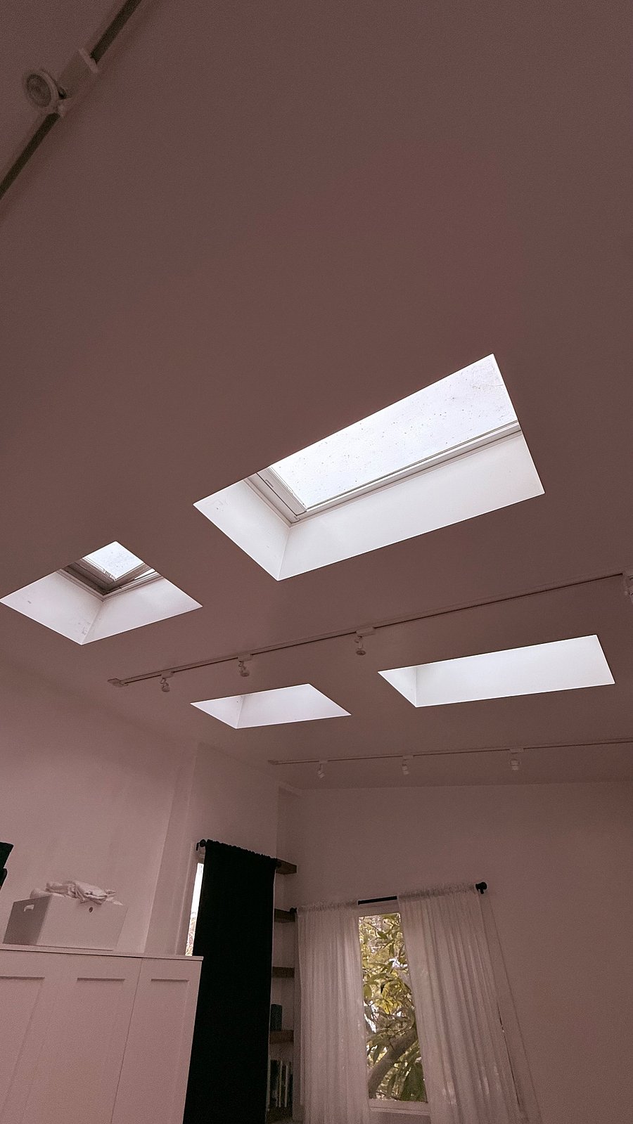 Skylights with remote operated blackout shades