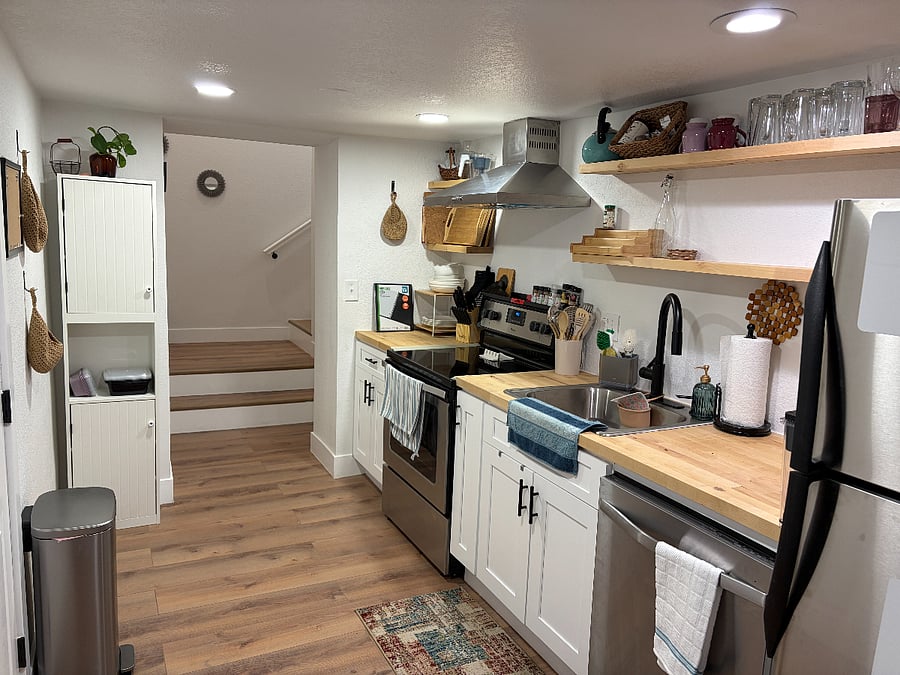 At the bottom of the stairs is the full kitchen