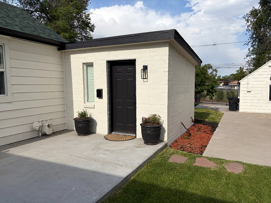 Separate front door entry - notice the parking area behind this entrance and to the left of the far garage