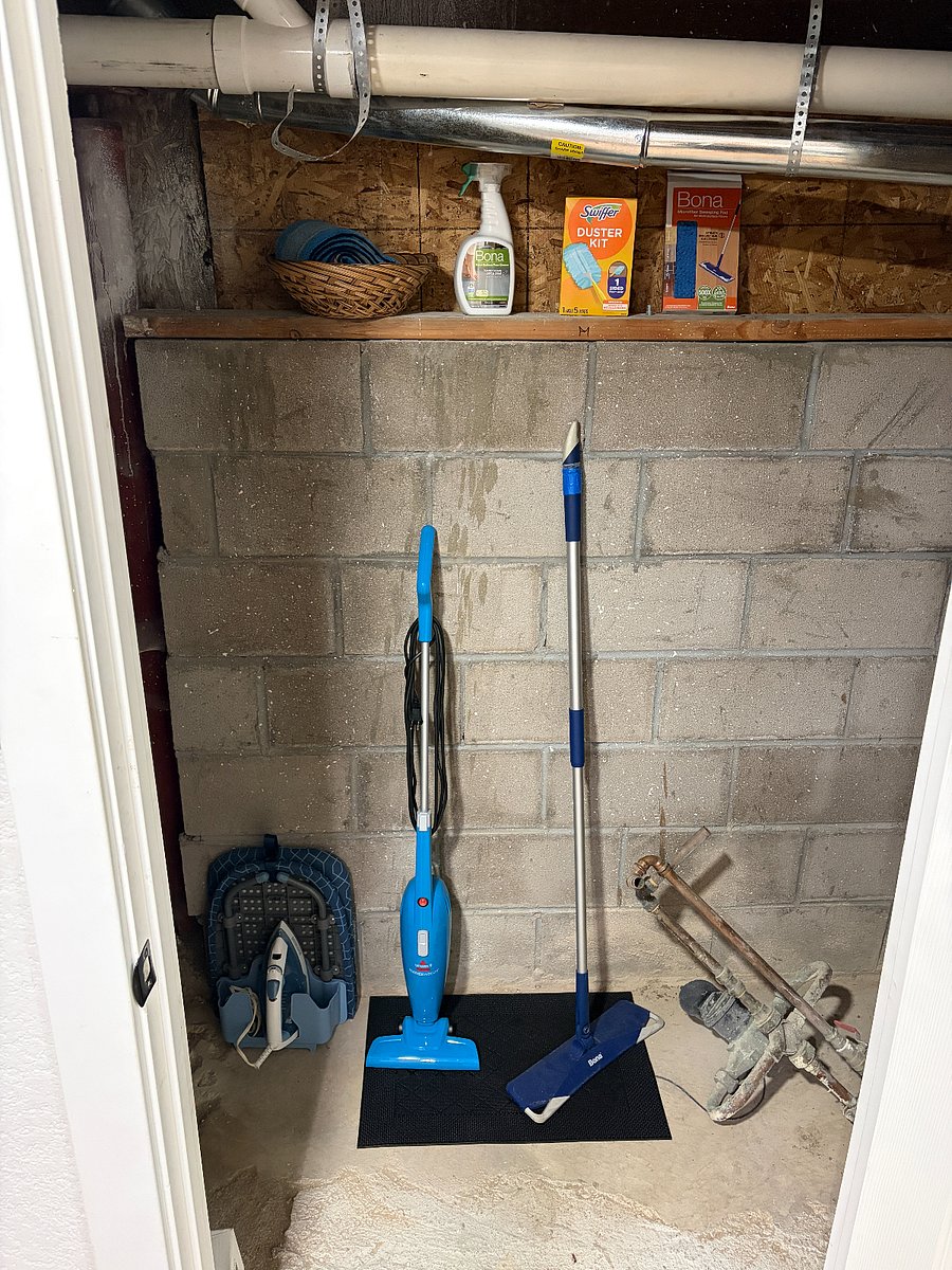 Within the closet off the kitchen, you can find some helpful items to keep the space clean.