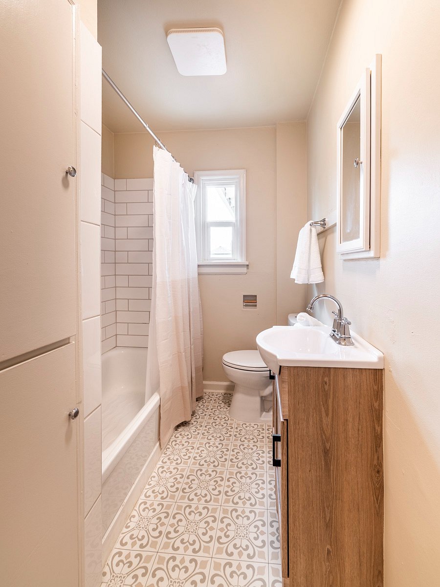 Full bathroom with tub and shower