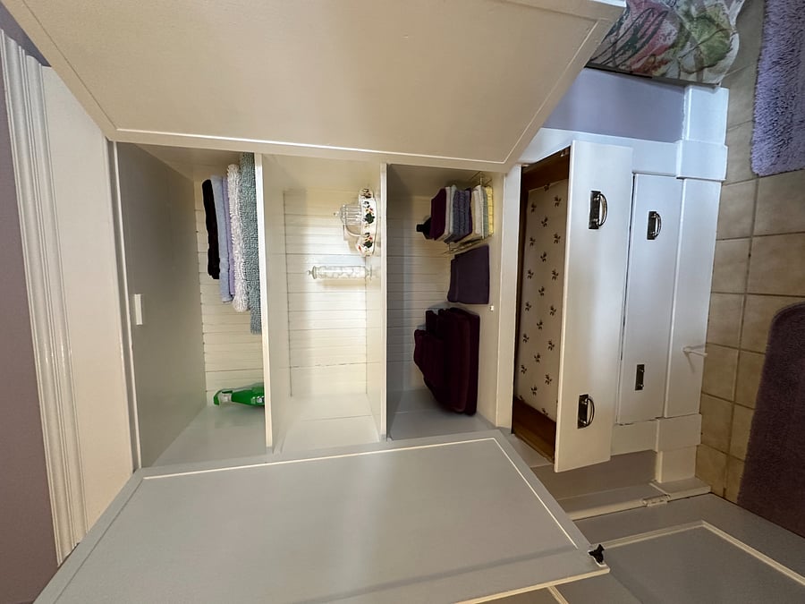 Additional built-in shelving inside bathroom