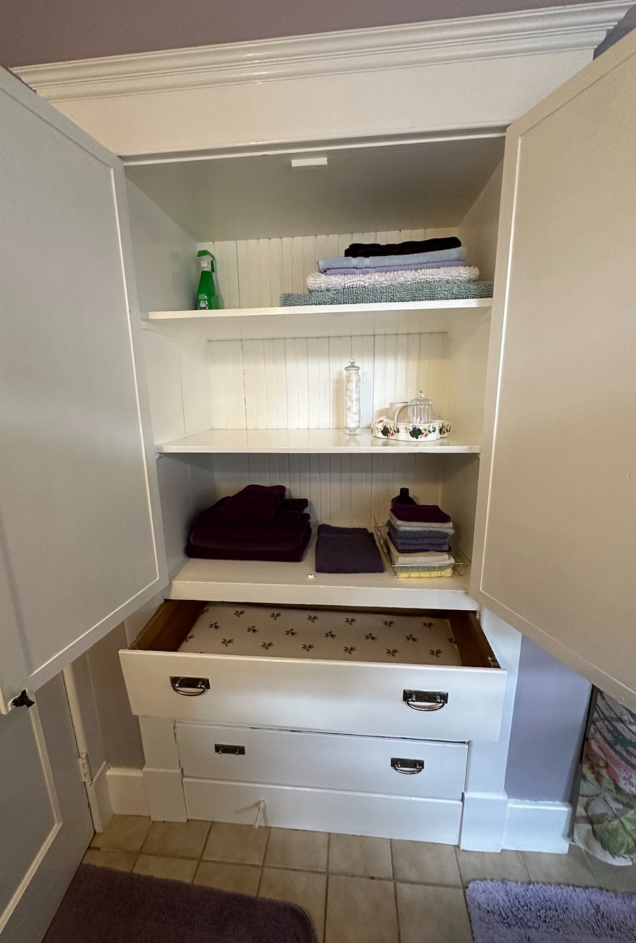 Additional built-in shelving inside bathroom