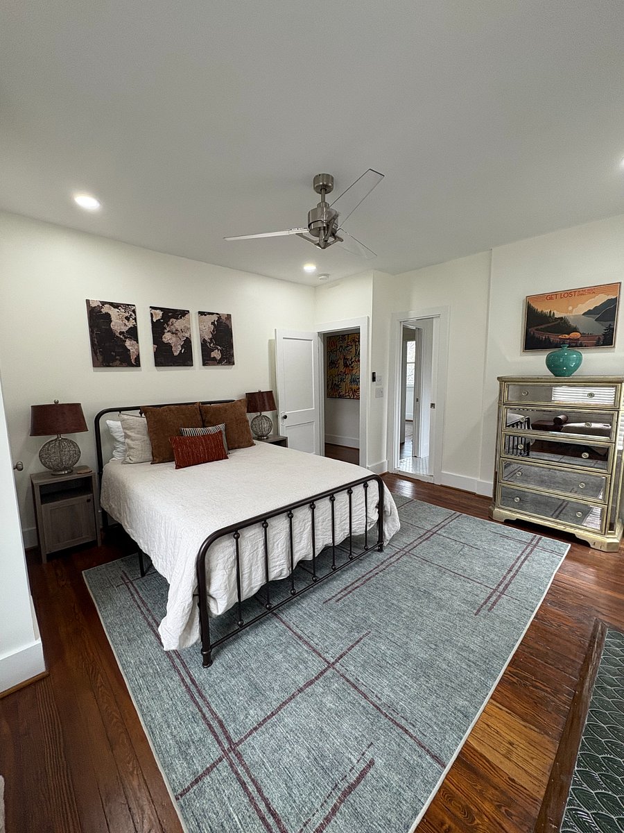 Bedroom 2 features a queen bed with ample storage for clothing