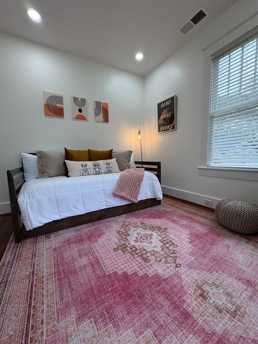 Bedroom 1 features a twin bed with a pull-out trundle, providing additional sleeping space as needed