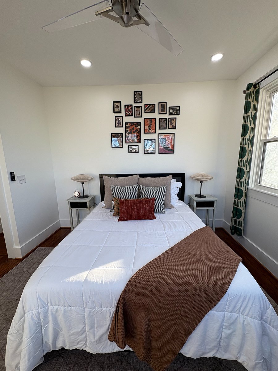 Another view of Bedroom 3 showcasing the bed and layout