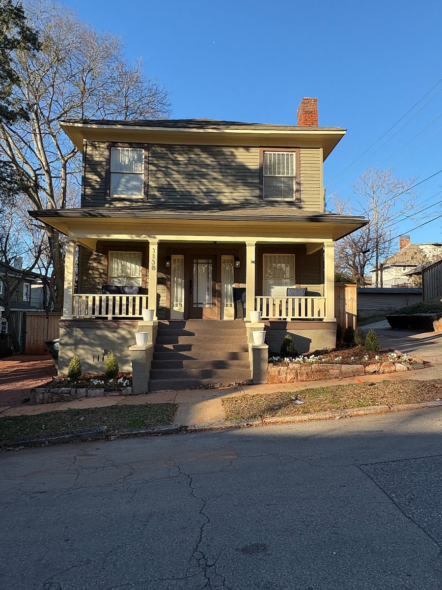 Front exterior of the home showing stairs leading to the entrance
