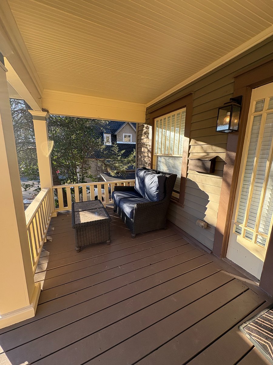 Front porch with wicker seating, ideal for relaxing after a long day