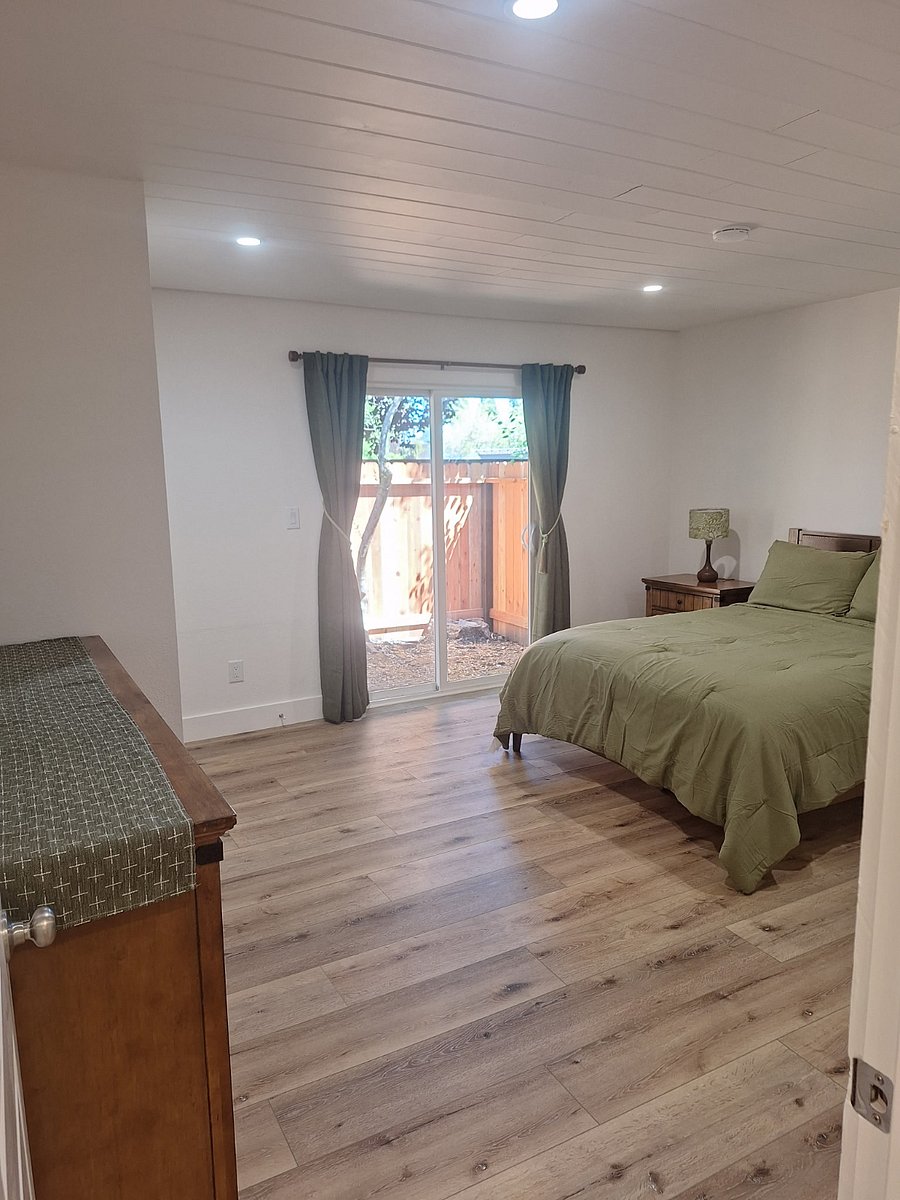 Primary Bedroom with Queen Bed, Large Dresser and Night Stands