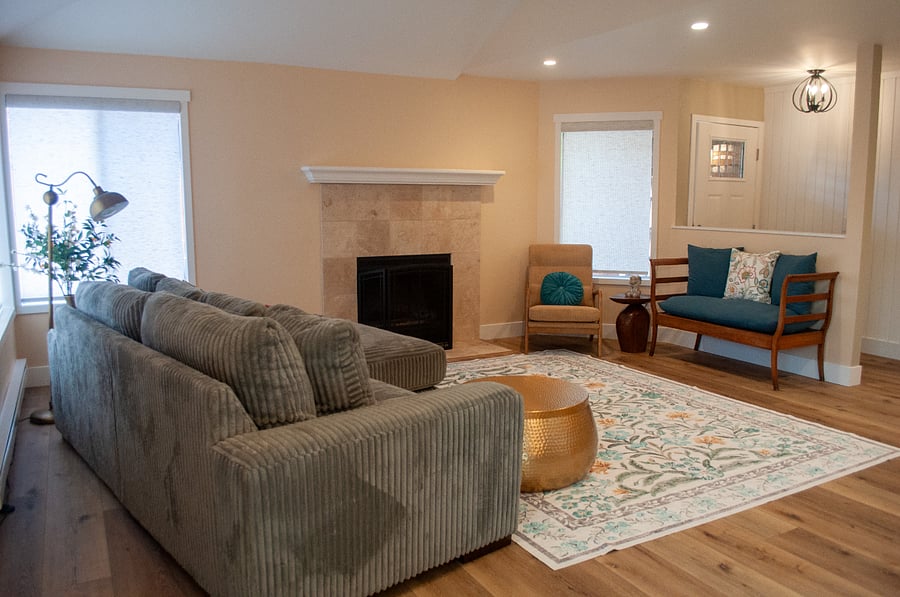 Super Comfy Living Room with Wood Burning Fireplace and Windows Surrounding