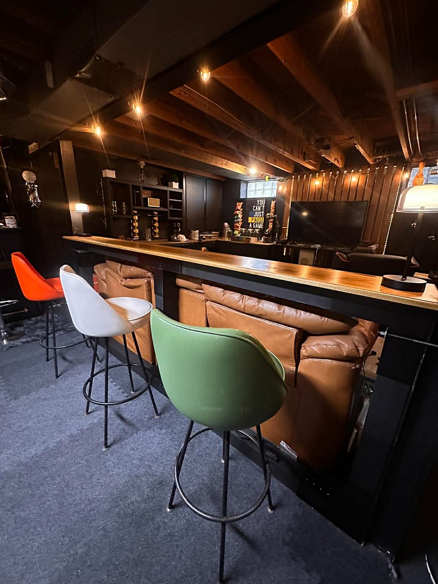 Lower Level Lounge has bar top over the comfy big leather couch.