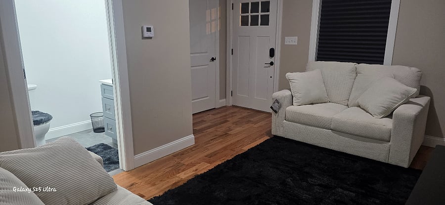 living room, 1st floor half of bathroom, front room closet, and front door