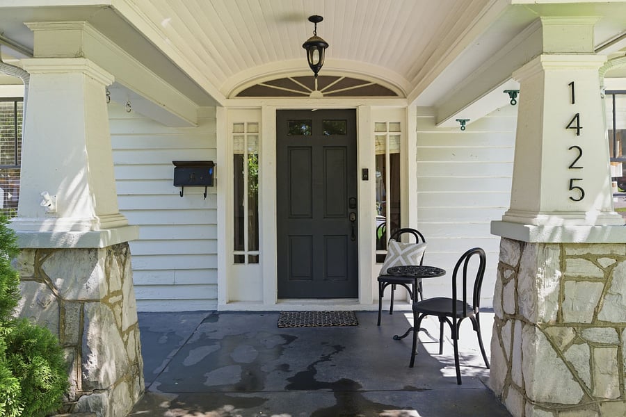 You'll love taking in the neighborhood from the charming front porch. Want more privacy? Keep scrolling for the screened-in back porch. 