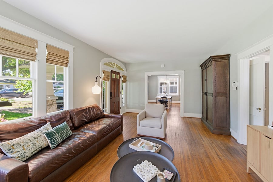We've added thoughtfully curated storage solutions throughout our home, like this Restoration Hardware armoire in the entryway. Historic charm paired with the modern storage space renters actually need.