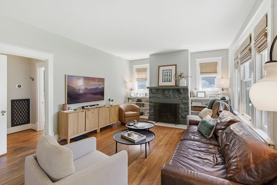 Our living room is bright and inviting with plenty of natural light. Featuring a Restoration Hardware leather sofa, Frame Samsung Art TV, Sonos soundbar, and original 100+ year old hardwood floors that add authentic character.