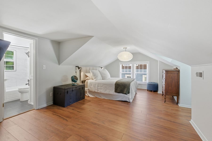 Spacious upper floor bedroom with queen bed, walk-in closet, and ensuite bathroom. Your own private retreat upstairs