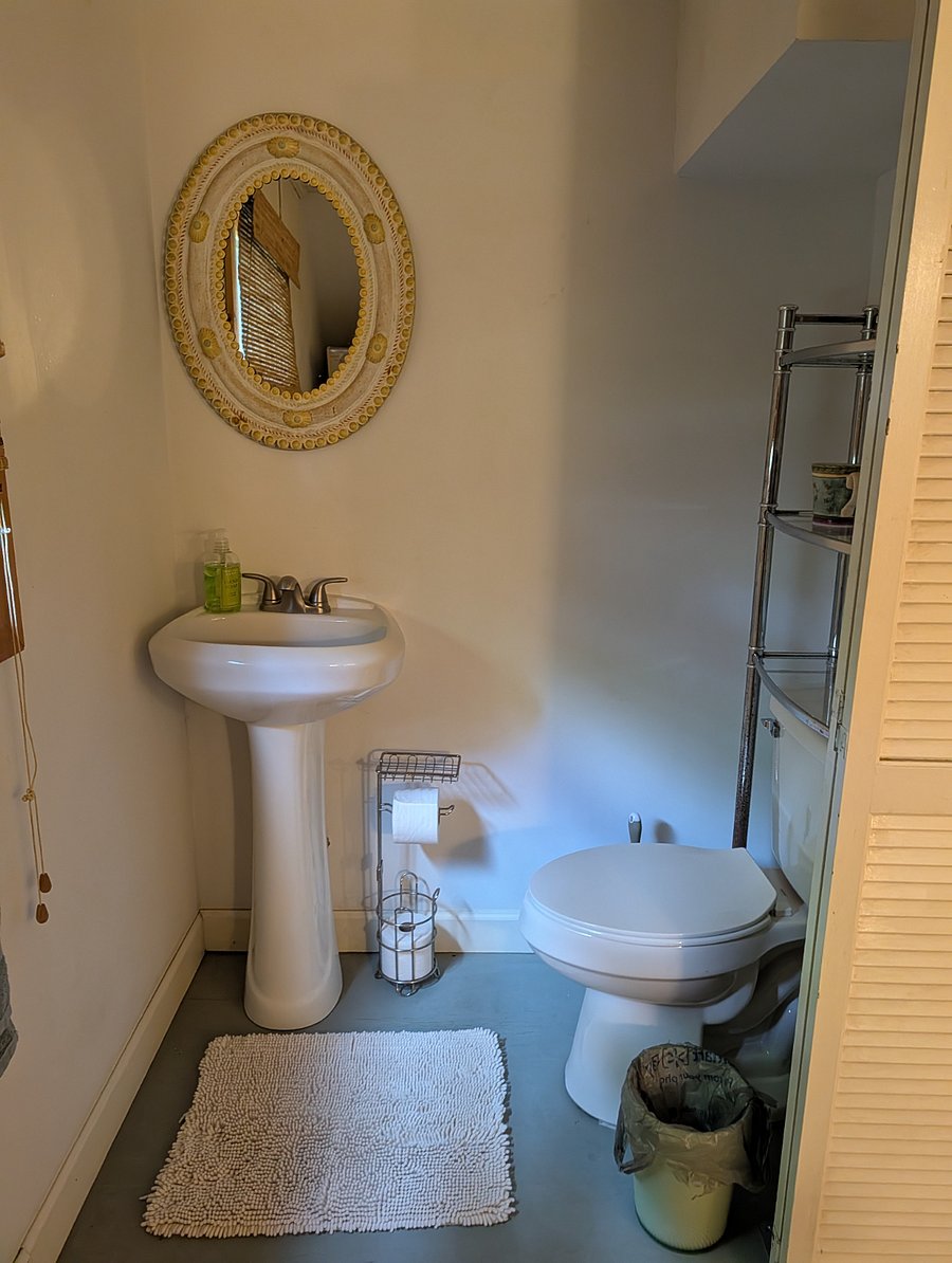 Half bath off of downstairs bedroom