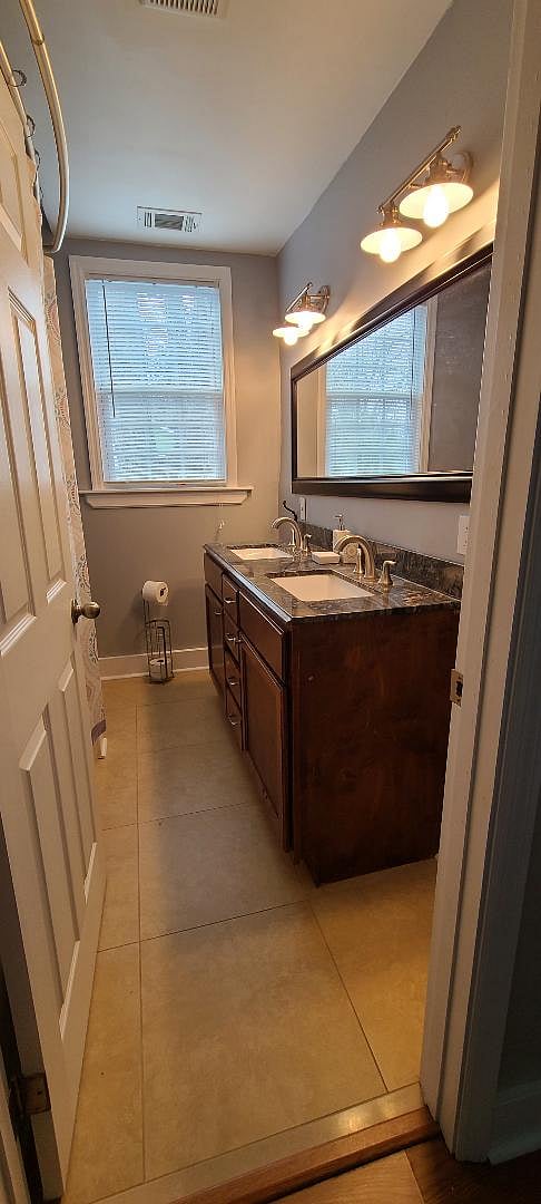 Hall bathroom with double vanity