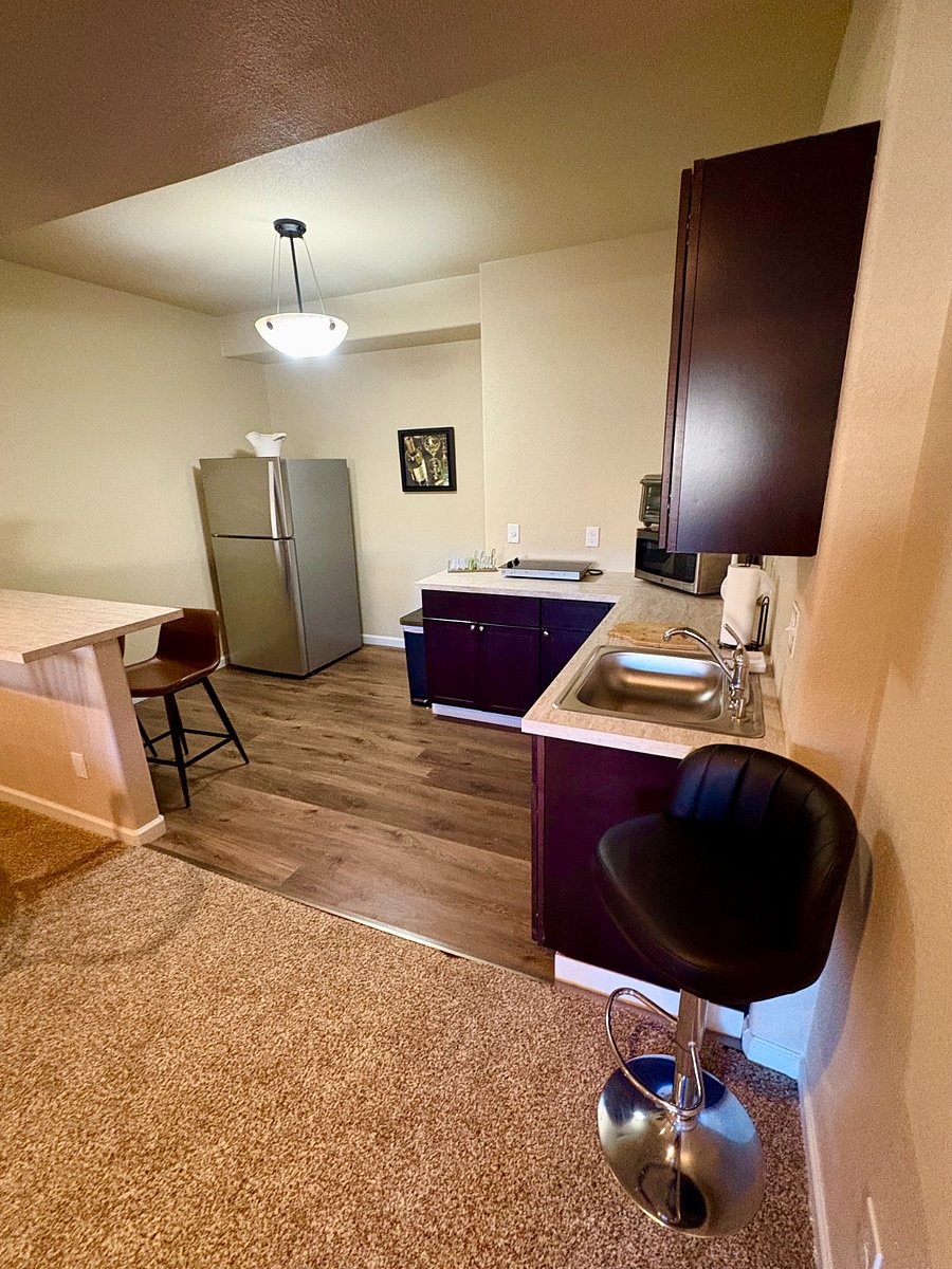 Everything you need here, microwave, cooktop, full size refrigerator, small convection oven/toaster oven. Plus all the utensils, dinnerware, pots and pans, dish soap etc.