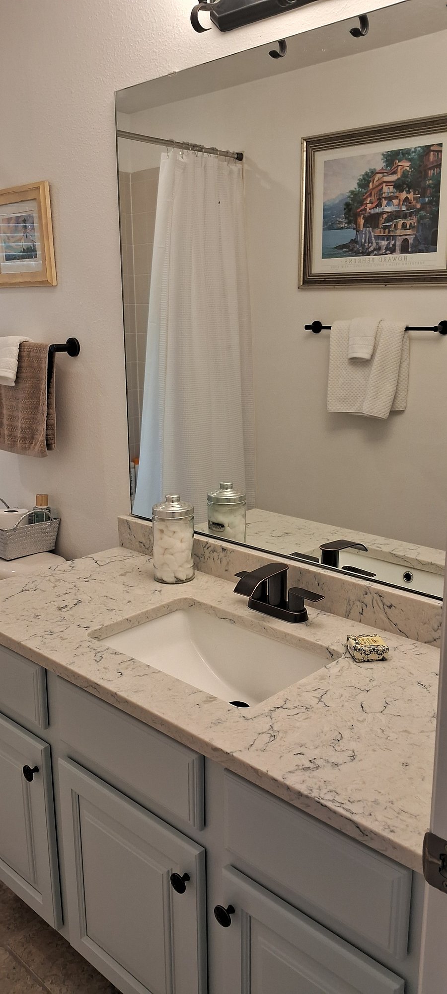 Guest bath also features new quartz countertops, cabinets and oil-rubbed bronze hardware