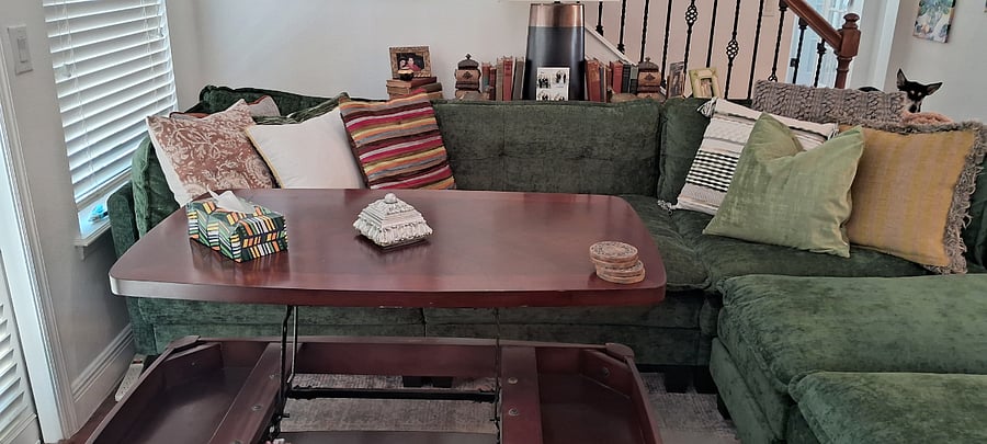 Surprise! The coffee table actually opens up to dining table height, for those nights you want to enjoy dinner & a movie!