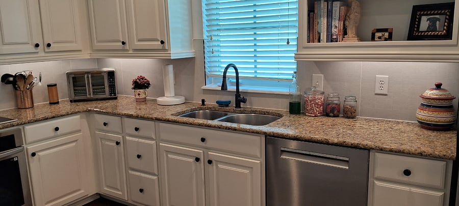 Kitchen overlooks side yard and gets lovely light.
