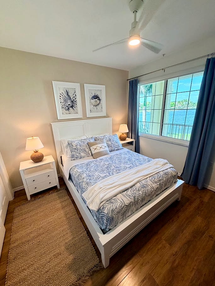 Guest room with queen bed and views of the lake