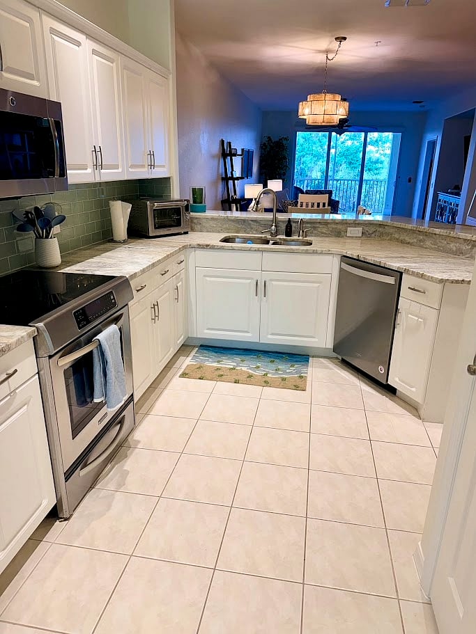 Fully stocked kitchen with additional seating at the bar