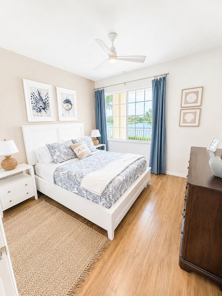 Guest bedroom with queen bed and views of the lake
