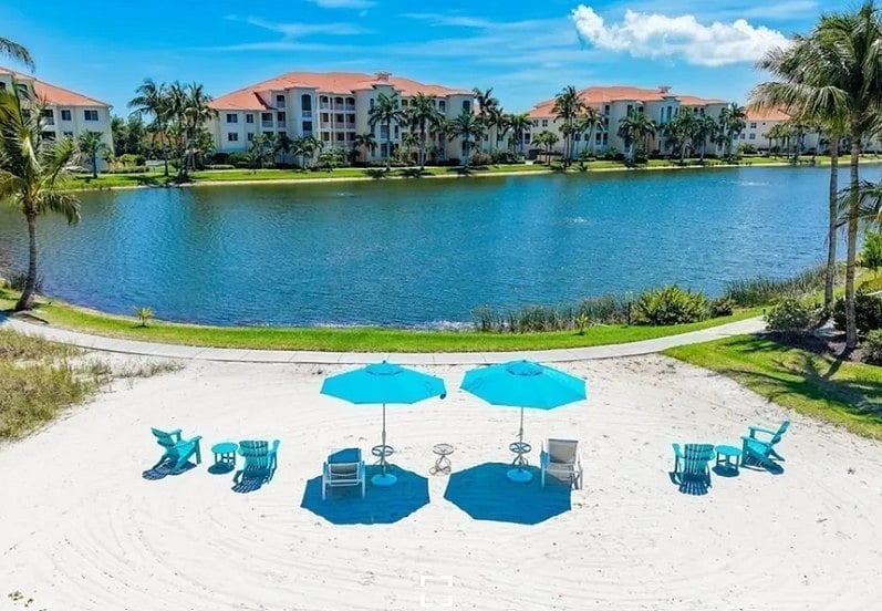 Beach area with sun loungers and umbrella
