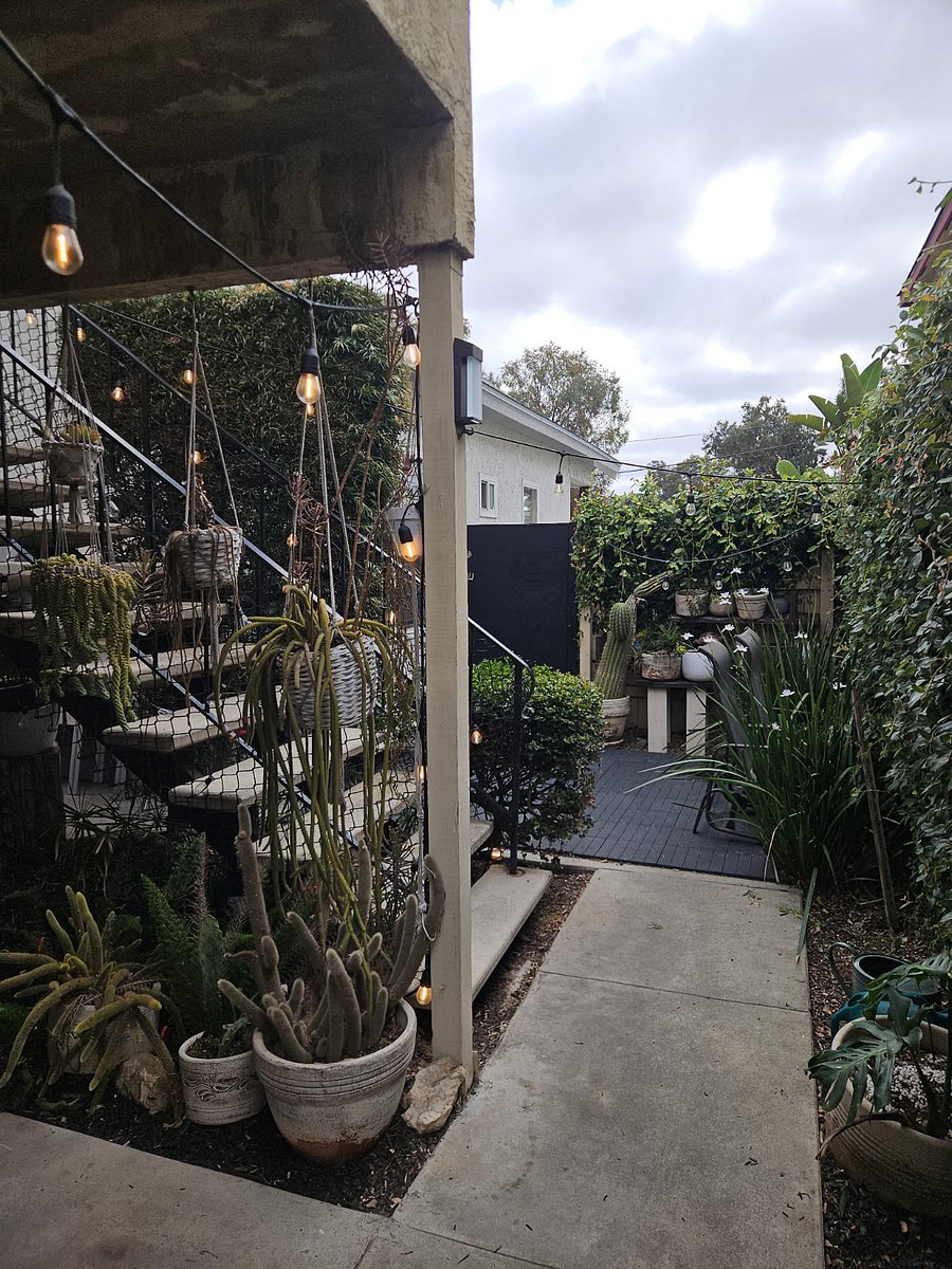Front door is just to your left but not in picture. This shows the patio area and stairs up to the upstairs neighbors apartment 
