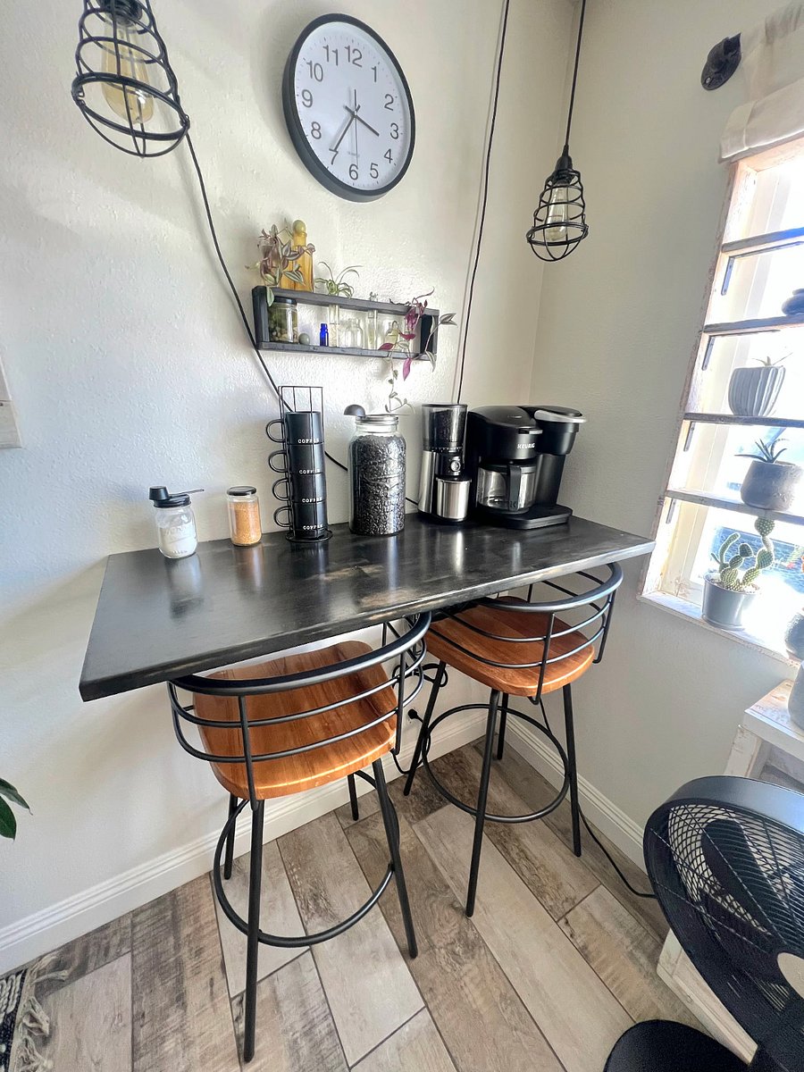 Coffee bar located between the dining table and kitchen