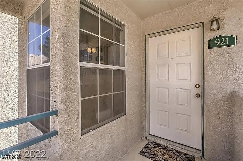 Unit front door and guest bedroom window