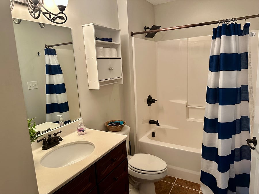 Large full bathroom With rain shower head with large linen closet for additional storage