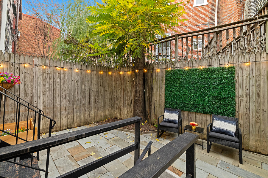 Private Fenced Yard with String Lights