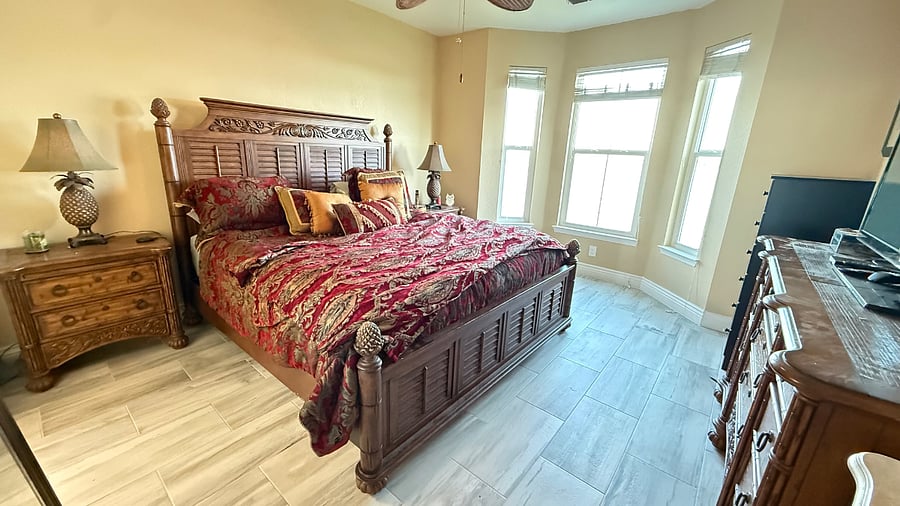 Large Master bedroom, king bed, dresser, 2 night stands, and bay windows overlooking your view of the bay.