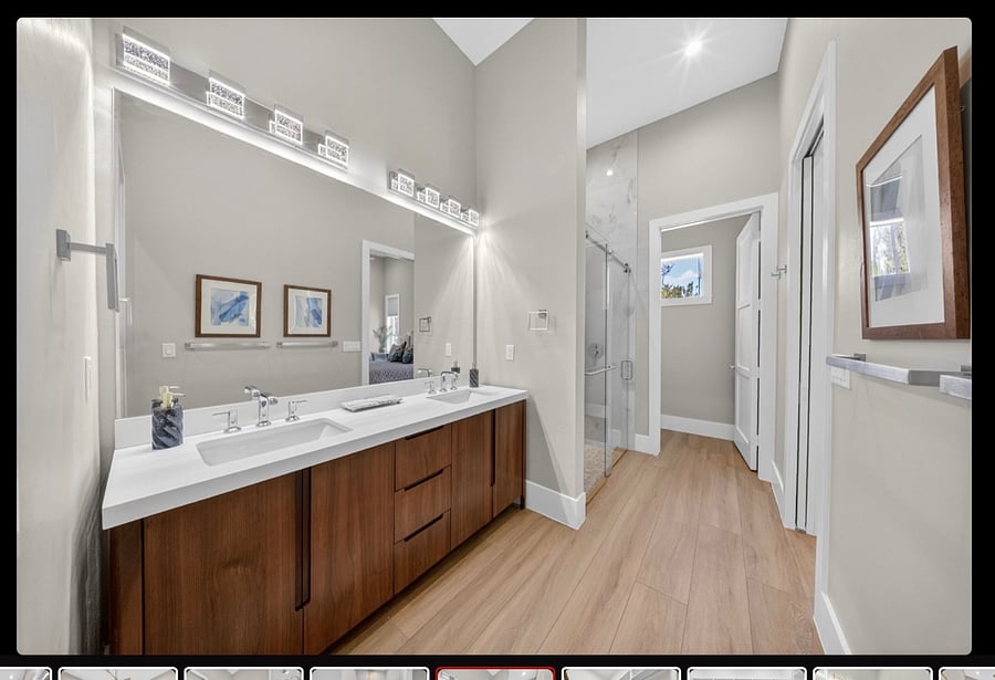 Primary Bathroom with Double Sink, walk in Shower and separated Commode .