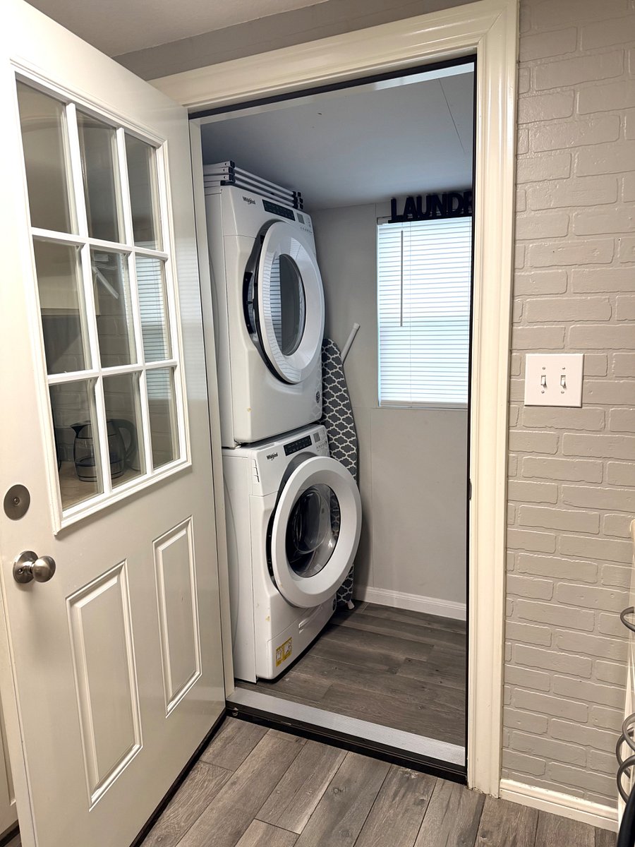 Full size washer and dryer adjacent to kitchen 