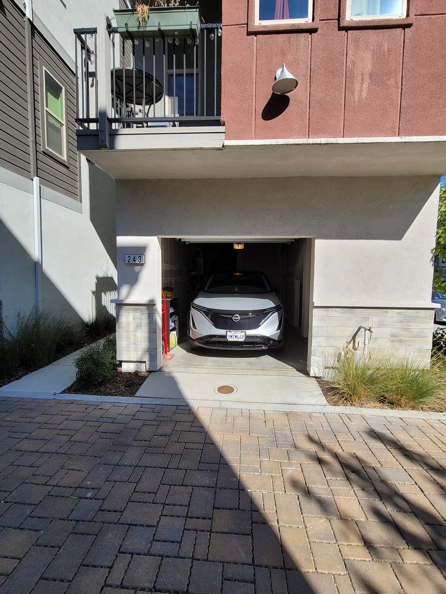 Garage with a Nissan Ariya parked in it for scale/limitations 