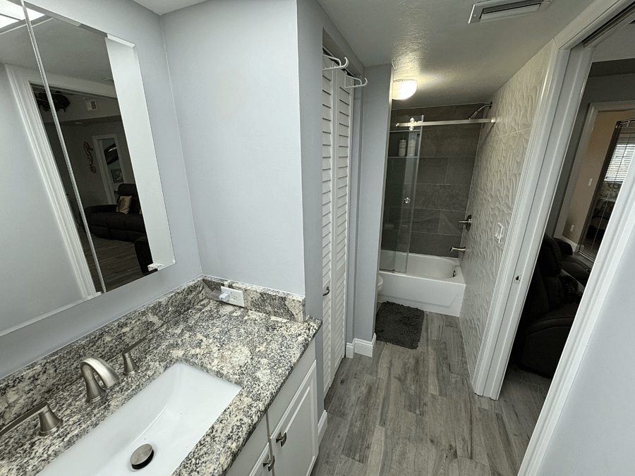 Bathroom off of living room, full bathroom with linen closet