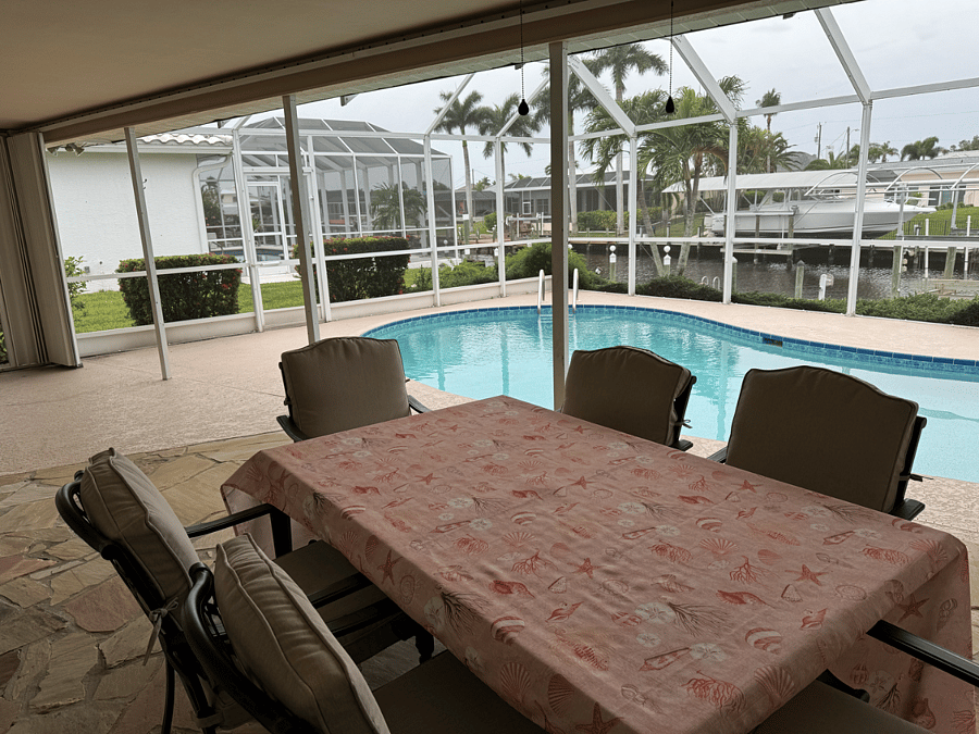 Lanai area with pool and table for 6. Also a propane powered grill