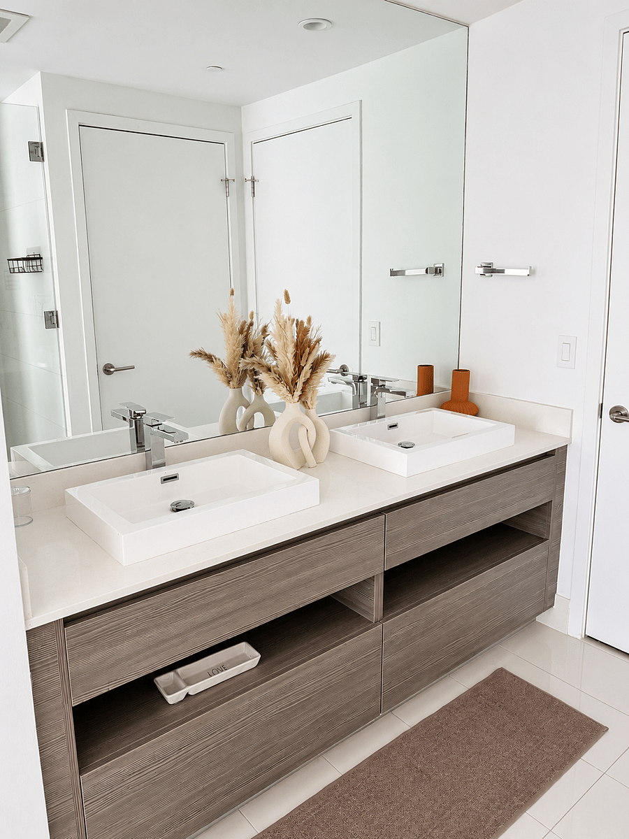 Luxurious en-suite bathroom featuring a spacious vanity, walk-in closet, and a private water closet for added comfort and privacy. Thoughtfully designed to create a serene, spa-like experience within the primary suite.