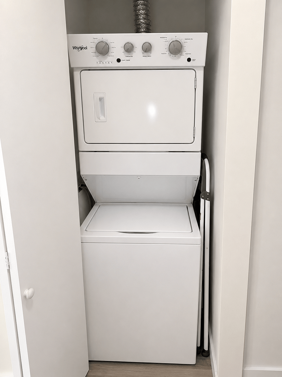 Convenient in-unit laundry featuring a stacked washer and dryer, designed for ease and efficiency. Perfect for extended stays, allowing guests to maintain comfort and convenience throughout their visit.