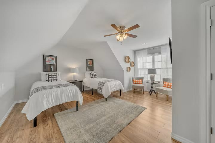 UPSTAIRS LARGE ROOM 2 XL TWIN BEDS, COULD BE MASTER SUITE. 55 INCH MOUNTED TV.