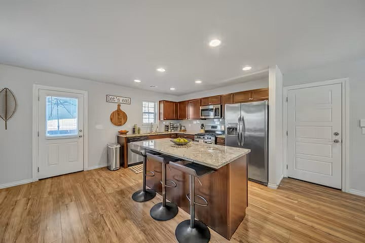 KITCHEN W/ ISLAND. DOOR TO BACK YARD